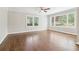 Bright living room with hardwood floors, neutral paint, white trim, and a wall of sun-filled windows at 353 Oak Ridge Se Dr, Marietta, GA 30060