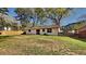 Spacious backyard with lush green grass and a wood fence, perfect for outdoor activities and relaxation at 4805 Kellys Mill Nw Dr, Lilburn, GA 30047