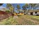 Spacious backyard with lush green grass and a wood fence, perfect for outdoor activities and relaxation at 4805 Kellys Mill Nw Dr, Lilburn, GA 30047
