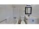 Clean bathroom featuring a shower and tub, white vanity and new lighting fixture at 4805 Kellys Mill Nw Dr, Lilburn, GA 30047