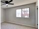 Bedroom featuring neutral walls, carpet, a large window, and a ceiling fan at 4805 Kellys Mill Nw Dr, Lilburn, GA 30047