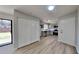 Open concept kitchen featuring new stainless steel appliances, gray cabinets, and modern finishes at 4805 Kellys Mill Nw Dr, Lilburn, GA 30047