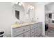 Bathroom featuring double vanities with stone countertop and modern lighting at 966 Laurel Springs Sw Ln, Marietta, GA 30064