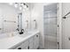 Bathroom features a vanity and a glass enclosed shower and tub combo at 966 Laurel Springs Sw Ln, Marietta, GA 30064