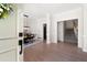 Inviting entryway featuring hardwood floors that lead to an open dining area and the staircase at 966 Laurel Springs Sw Ln, Marietta, GA 30064