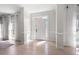 Bright foyer with hardwood floors, elegant trim, and a front door with decorative glass inserts at 966 Laurel Springs Sw Ln, Marietta, GA 30064