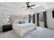 Main bedroom with tray ceilings, large windows, and ensuite bathroom access at 966 Laurel Springs Sw Ln, Marietta, GA 30064