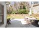 Relaxing patio with comfortable seating surrounded by a lush, fenced yard at 966 Laurel Springs Sw Ln, Marietta, GA 30064