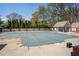 A community pool and bath house with a safety cover installed for the winter months at 966 Laurel Springs Sw Ln, Marietta, GA 30064