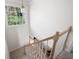 Carpeted staircase with natural wood railings leading to lower level at 966 Laurel Springs Sw Ln, Marietta, GA 30064