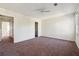 Spacious bedroom featuring carpet, ceiling fan, ample natural light, and an ensuite bathroom at 2391 Cove Rd, Lithonia, GA 30058