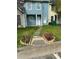 Charming townhouse with a walkway surrounded by beautiful flower beds leading to the front door at 2391 Cove Rd, Lithonia, GA 30058