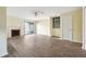 Bright living room with fireplace, ceiling fan, hardwood floors and sliding glass doors to backyard at 2391 Cove Rd, Lithonia, GA 30058