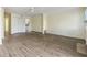 Open-concept living room featuring hardwood floors, a ceiling fan, and a view into the kitchen at 2391 Cove Rd, Lithonia, GA 30058