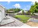 Landscaped backyard with healthy lawn, trees, flowerbeds and covered gazebo with chairs and table at 2650 Hamilton Chase Run, Buford, GA 30519
