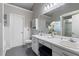 Bright bathroom featuring a double sink vanity, white cabinets, and a tiled shower area at 2650 Hamilton Chase Run, Buford, GA 30519