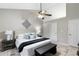 Airy primary bedroom featuring vaulted ceilings, ceiling fan and soft, neutral decor at 2650 Hamilton Chase Run, Buford, GA 30519