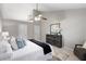 This cozy bedroom offers soft, natural light, a fan, and neutral decor at 2650 Hamilton Chase Run, Buford, GA 30519
