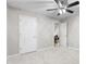Bedroom featuring neutral carpeting, a ceiling fan and two entryways at 2650 Hamilton Chase Run, Buford, GA 30519