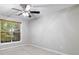 Bedroom featuring a window, neutral carpeting, ceiling fan and gray walls at 2650 Hamilton Chase Run, Buford, GA 30519