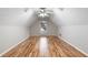 Bonus room or attic featuring hardwood flooring and a window at 2650 Hamilton Chase Run, Buford, GA 30519