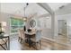 Dining room featuring wood-look floors, vaulted ceiling, and neutral decor at 2650 Hamilton Chase Run, Buford, GA 30519