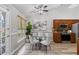 Cozy dining area with modern chairs and a view to the stained glass on the French doors at 2650 Hamilton Chase Run, Buford, GA 30519