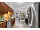 This kitchen features stainless steel appliances, granite countertops, and sleek cabinetry at 2650 Hamilton Chase Run, Buford, GA 30519