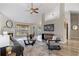 Bright and airy living room showcasing vaulted ceiling, fireplace, and wood-look floors at 2650 Hamilton Chase Run, Buford, GA 30519