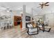 Open-concept living area featuring vaulted ceilings, modern lighting, and stylish decor at 2650 Hamilton Chase Run, Buford, GA 30519