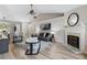 Bright living room featuring a fireplace with a marble hearth and decorative mantle at 2650 Hamilton Chase Run, Buford, GA 30519