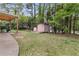 Large backyard featuring a shed and mature trees for privacy at 2720 Cold Springs Sw Trl, Marietta, GA 30064