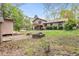 Large backyard featuring a fire pit and mature trees at 2720 Cold Springs Sw Trl, Marietta, GA 30064