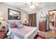 This bedroom features a mirror, closet, and hardwood floors at 2720 Cold Springs Sw Trl, Marietta, GA 30064