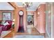Inviting entryway featuring hardwood floors, grandfather clock, and view into the dining room at 2720 Cold Springs Sw Trl, Marietta, GA 30064