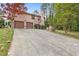 Exterior view of home with long driveway leading to the two car garage at 2720 Cold Springs Sw Trl, Marietta, GA 30064