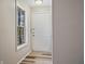 Bright entryway with laminate floors, a front door, and a window at 409 Natchez Trce, Sandy Springs, GA 30350