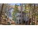 Angle shot of the side exterior of the gray two-story condo with long staircases at 409 Natchez Trce, Sandy Springs, GA 30350