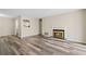 Spacious living room with stone fireplace and laminate flooring throughout at 409 Natchez Trce, Sandy Springs, GA 30350