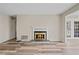 Living room with a stone fireplace, laminate floors and white trim at 409 Natchez Trce, Sandy Springs, GA 30350