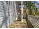 Exterior back stairway with access to the unit, nice wood deck with a lattice railing and tree views at 409 Natchez Trce, Sandy Springs, GA 30350