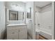 Updated bathroom featuring a vanity with double sinks, modern fixtures, and a tub/shower combo at 409 Natchez Trce, Sandy Springs, GA 30350