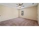 Bedroom featuring neutral walls, carpeted floors, ceiling fan, and natural light from a window at 409 Natchez Trce, Sandy Springs, GA 30350