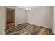 Open dining room with wood-look floors and modern lighting at 409 Natchez Trce, Sandy Springs, GA 30350