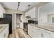 The kitchen featuring white cabinets and modern appliances at 409 Natchez Trce, Sandy Springs, GA 30350