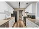 Modern kitchen with white cabinets and stainless steel appliances at 409 Natchez Trce, Sandy Springs, GA 30350