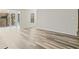 View of the sun room featuring wood-look flooring and many windows at 409 Natchez Trce, Sandy Springs, GA 30350