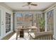 Sun room featuring walls of windows and an adjacent door at 409 Natchez Trce, Sandy Springs, GA 30350