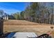 Expansive backyard with a lawn and treeline providing a serene view and ample space for outdoor enjoyment at 904 Magnolia Leaf Dr, Woodstock, GA 30188