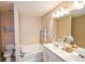 Bright bathroom featuring double sinks and a separate bathtub at 904 Magnolia Leaf Dr, Woodstock, GA 30188